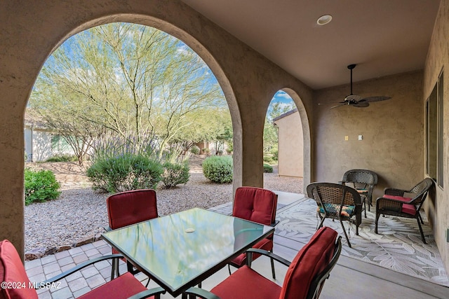 view of patio featuring ceiling fan