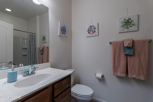 bathroom with vanity, toilet, and a shower with shower curtain