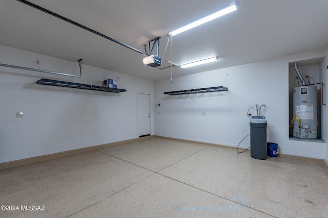 garage featuring water heater and a garage door opener