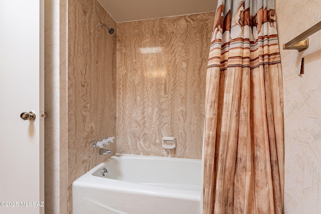 bathroom with shower / bath combo with shower curtain