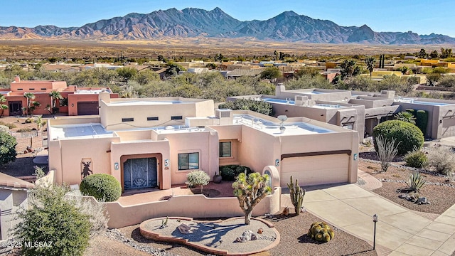 exterior space featuring a mountain view and a garage