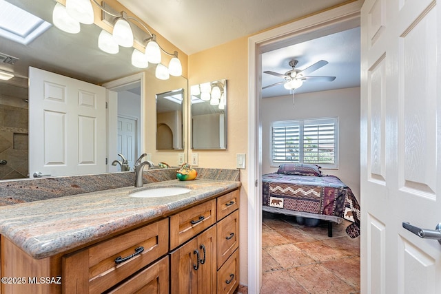 bathroom with ceiling fan and vanity