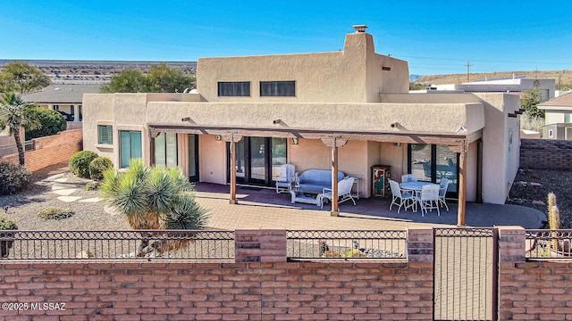 rear view of house with a patio area