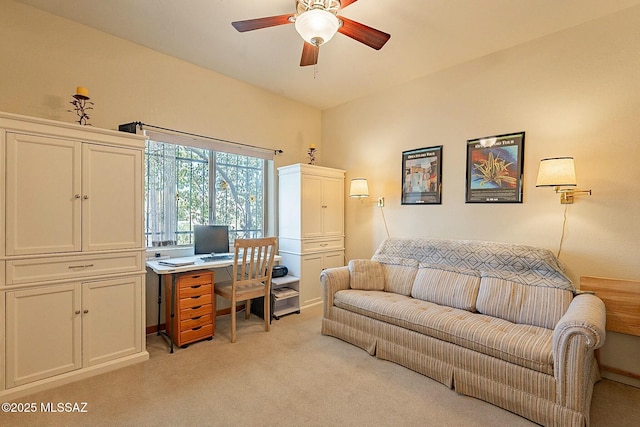 carpeted office space with ceiling fan