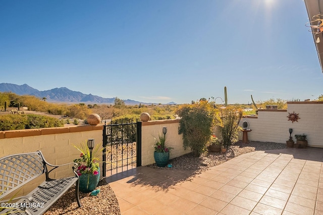 view of patio / terrace featuring a mountain view