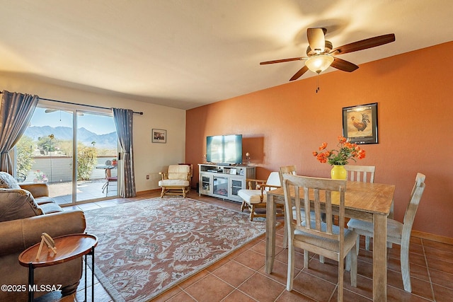 tiled living room featuring ceiling fan