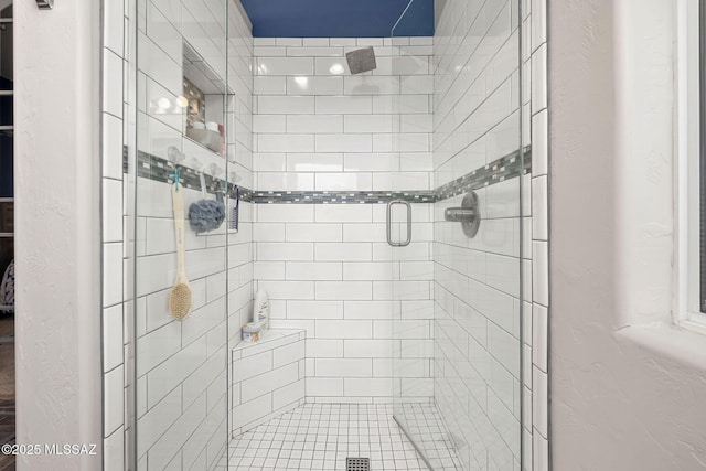 bathroom with a shower stall