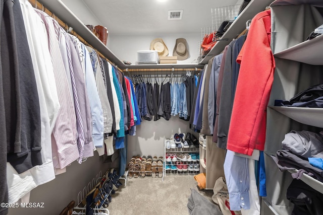 spacious closet with carpet flooring and visible vents