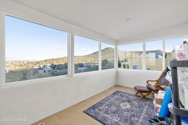 sunroom / solarium with a mountain view