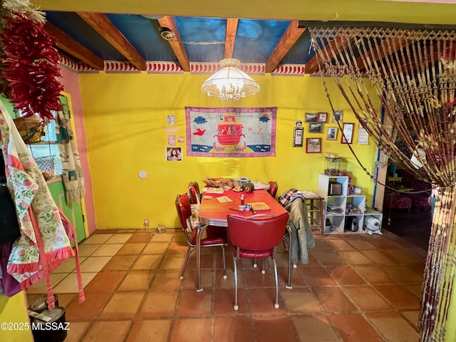 tiled dining area featuring a notable chandelier