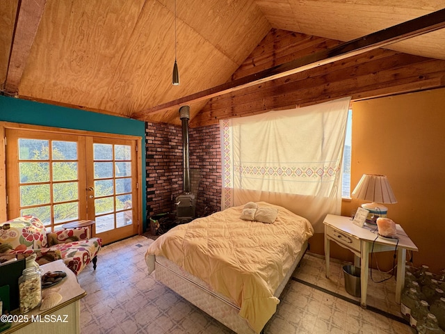 bedroom featuring vaulted ceiling, a wood stove, access to outside, wooden ceiling, and french doors