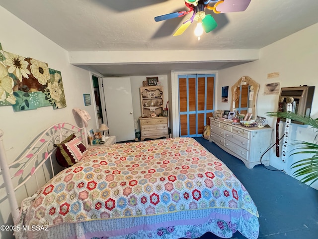 bedroom featuring ceiling fan and carpet flooring