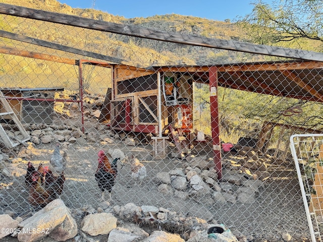 exterior space featuring a mountain view and an outdoor structure