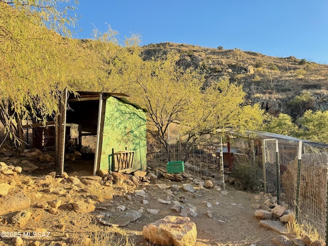 exterior space featuring an outdoor structure and a mountain view