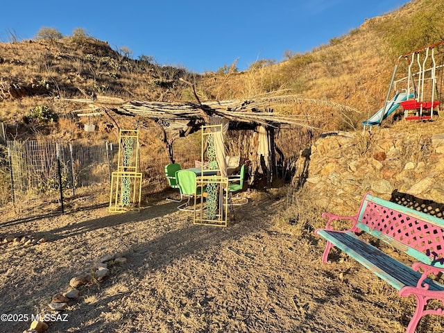 view of jungle gym featuring a mountain view