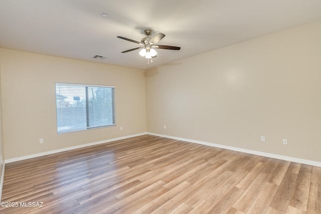 unfurnished room featuring ceiling fan and light wood-type flooring