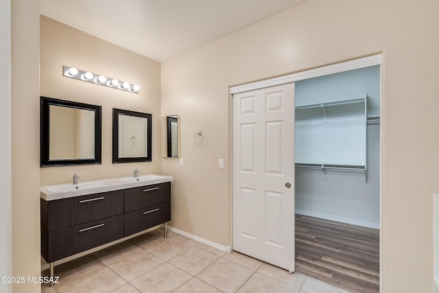 bathroom featuring tile patterned flooring and vanity