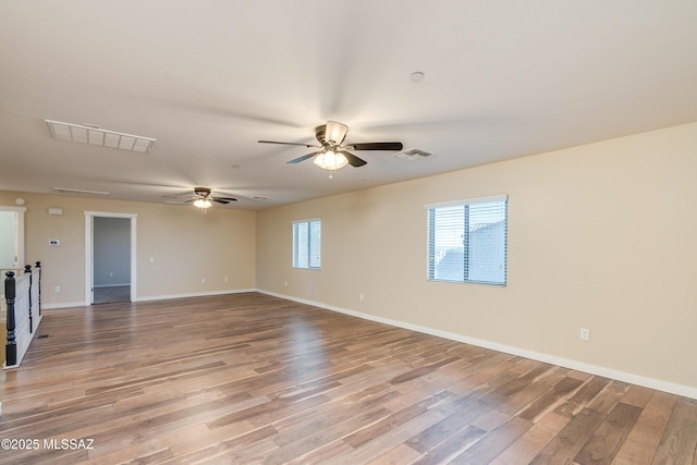 empty room featuring ceiling fan and light hardwood / wood-style flooring