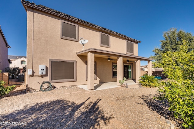 back of house featuring ceiling fan and a patio