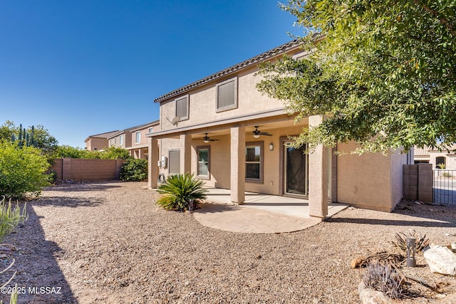 back of property featuring a patio and ceiling fan