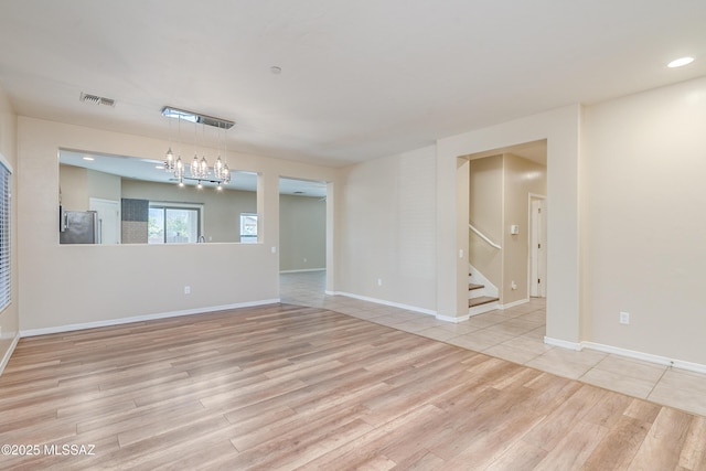 unfurnished room featuring light wood-type flooring