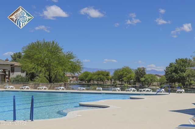 view of pool featuring a water view