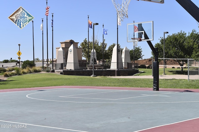 view of sport court featuring a yard