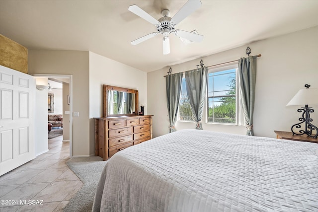 tiled bedroom with ceiling fan