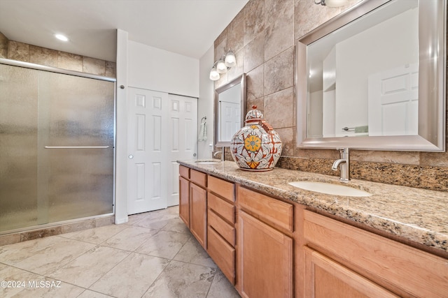 bathroom with vanity and walk in shower