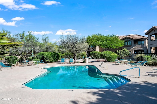 view of pool featuring a patio