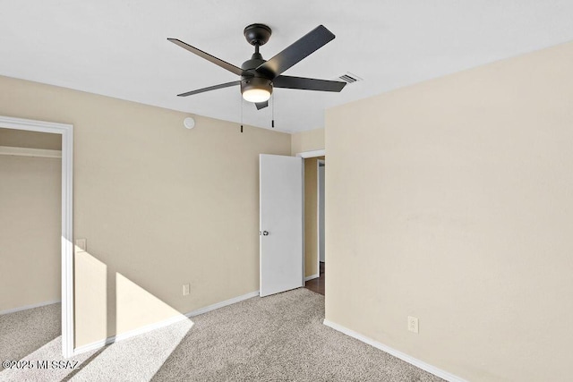 unfurnished bedroom with light carpet and ceiling fan