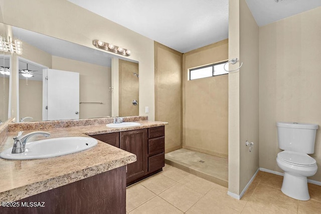 bathroom with tile patterned floors, ceiling fan, vanity, and toilet