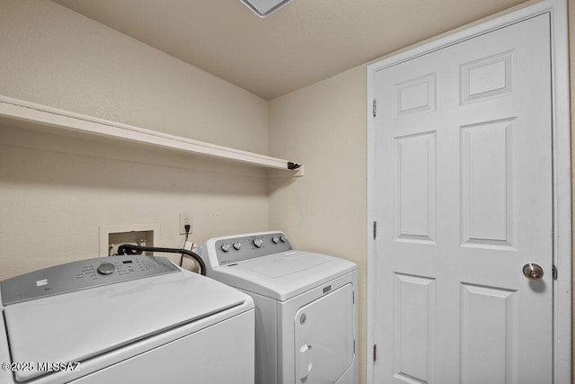 washroom with washing machine and dryer