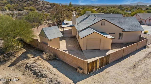 birds eye view of property with a mountain view