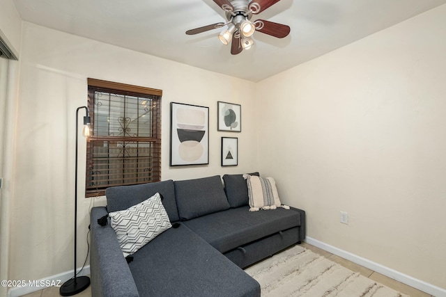 tiled living room with ceiling fan