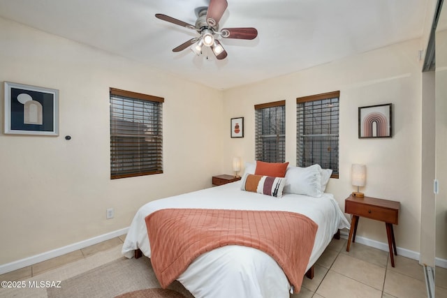 bedroom featuring light tile patterned floors and ceiling fan