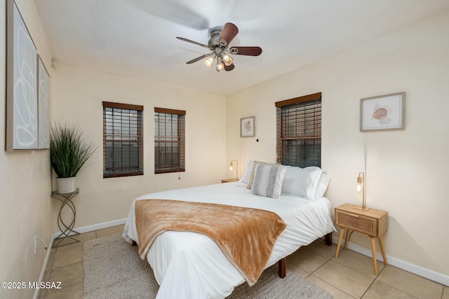 bedroom featuring light tile patterned floors and ceiling fan