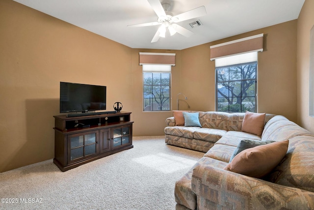 living room with carpet floors and ceiling fan