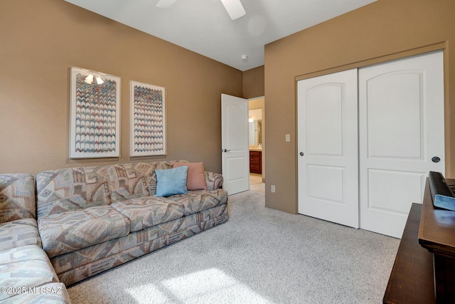 carpeted living room featuring ceiling fan