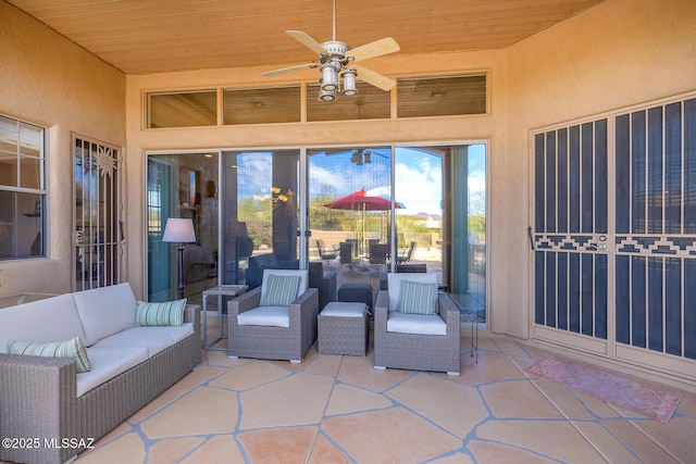 view of patio / terrace with an outdoor living space and ceiling fan