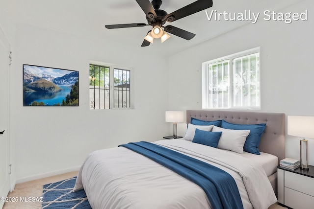 bedroom with carpet flooring, a ceiling fan, and baseboards