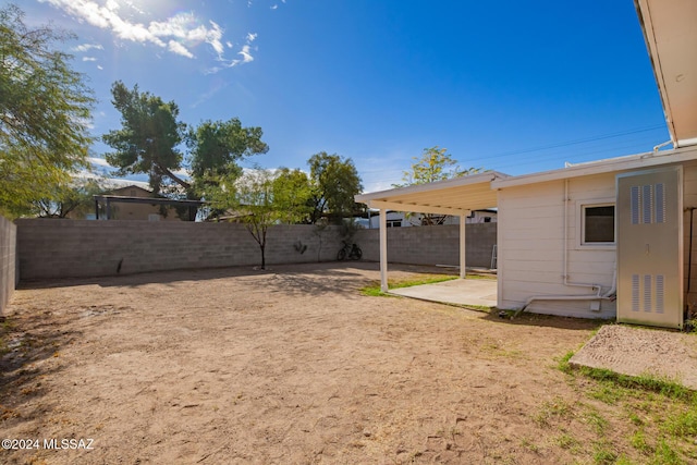 view of yard with a patio area and a fenced backyard