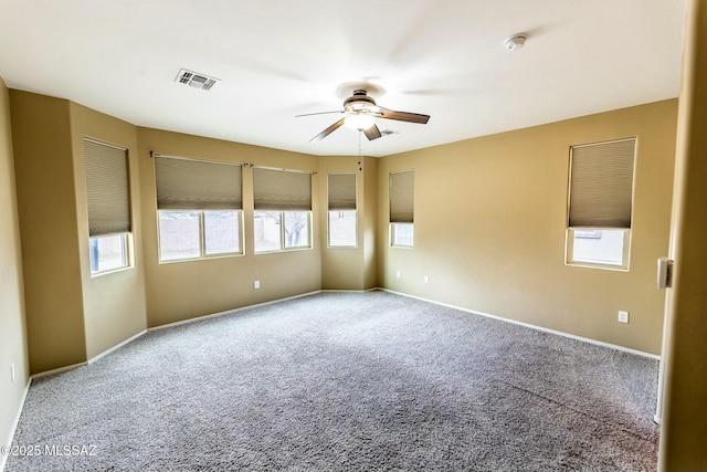 carpeted empty room featuring ceiling fan