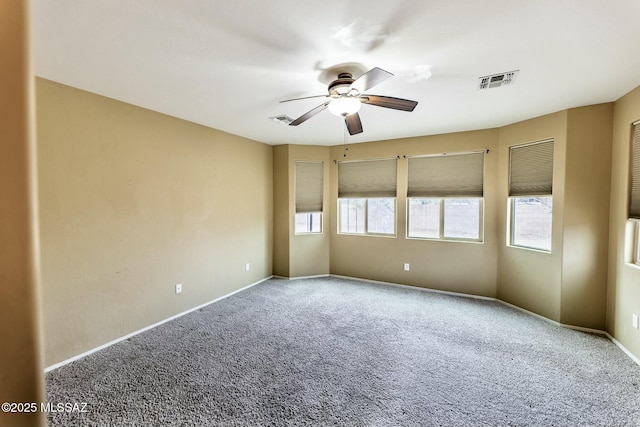 carpeted empty room with ceiling fan