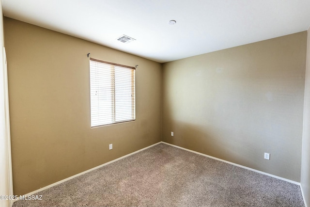 empty room featuring carpet floors