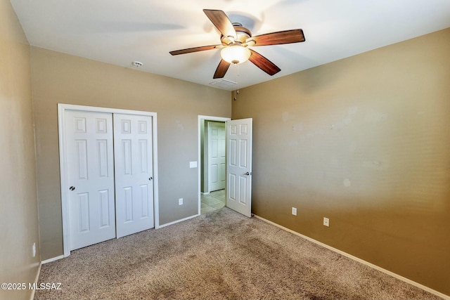 unfurnished bedroom with light carpet, ceiling fan, and a closet