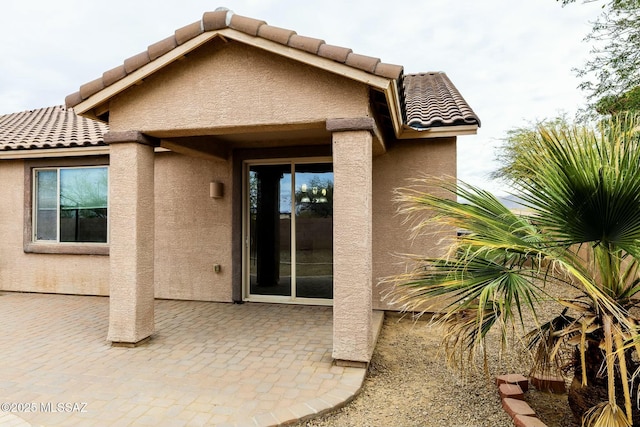 back of house with a patio area