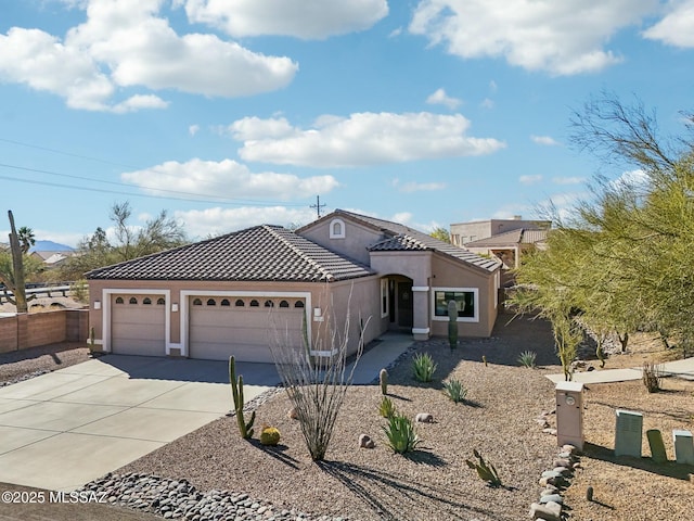 11215 N Via Rancho Naranjo, Oro Valley, AZ 85737 - view of front of house featuring a tiled roof, fence, an attached garage, stucco siding, and concrete driveway