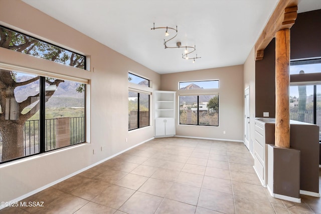 unfurnished sunroom with a notable chandelier and plenty of natural light