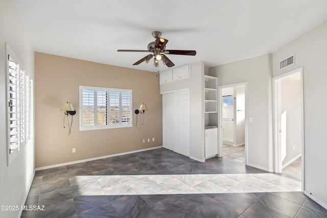 spare room with ceiling fan